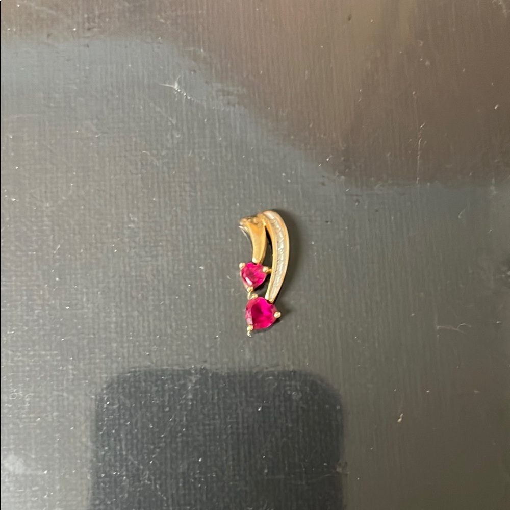 Source Unknown Gold and ruby pendant with Whimsical Design
